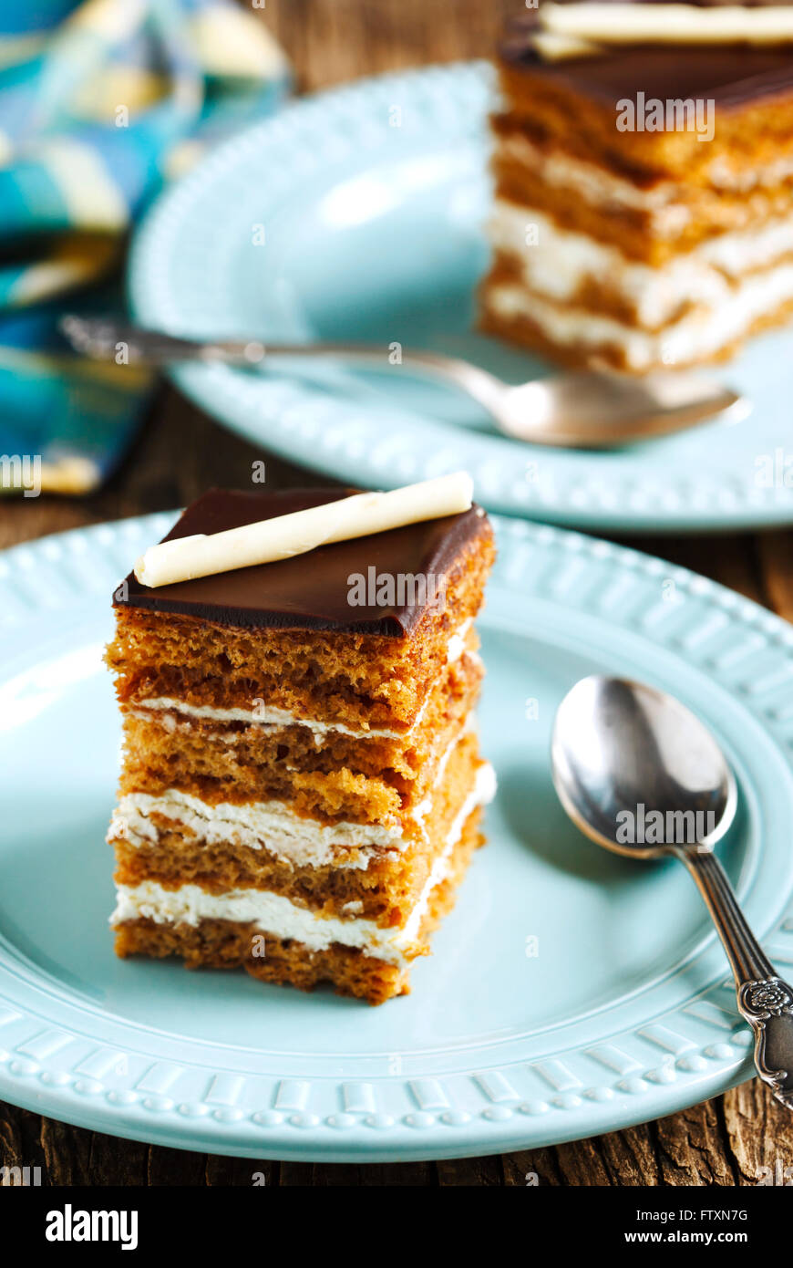 Piece of honey cake on a plate Stock Photo