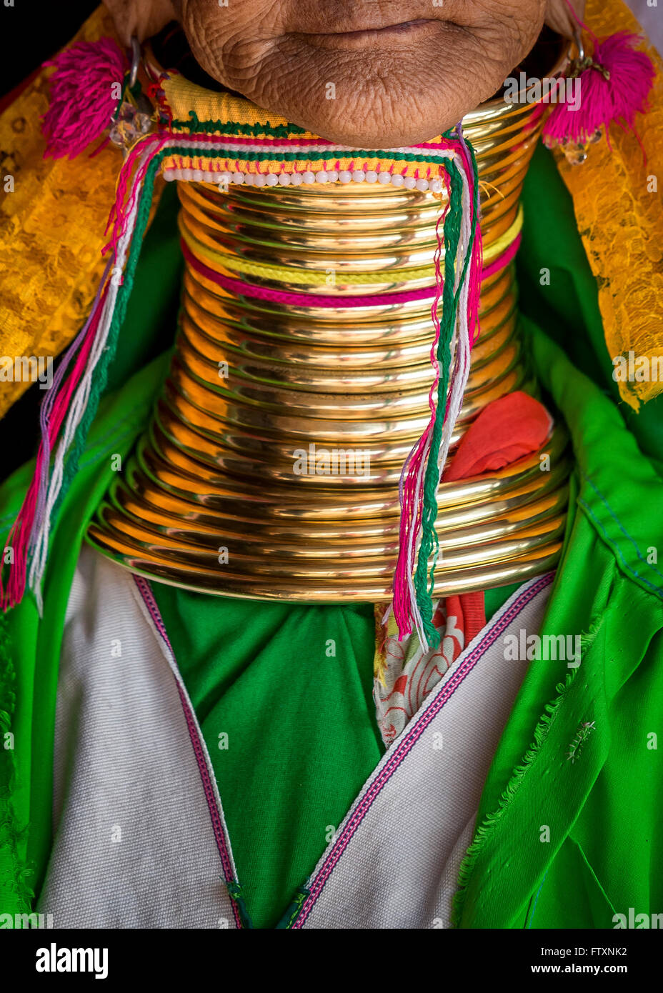 Padaung Tribe's Woman wearing golden rings around neck Stock Photo