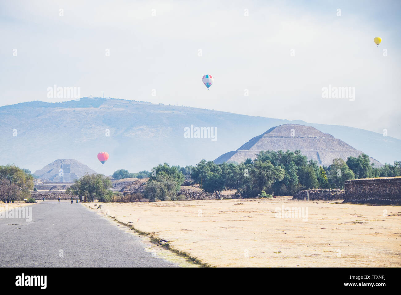 Hot air balloons flying over ancient ruins of Teotihuacan, Mexico Stock Photo