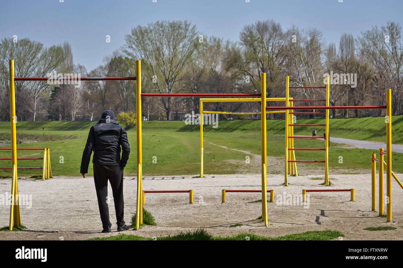 Man in the city park practicing physical activities in the morning Stock Photo