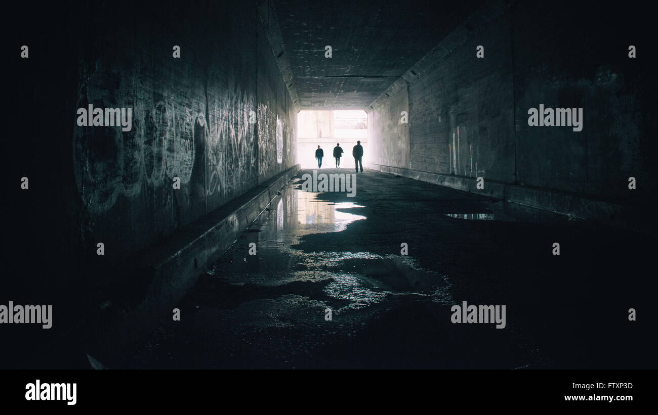 Silhouettes of three people in Sixth Street Tunnel, Los angeles, California, America, USA Stock Photo