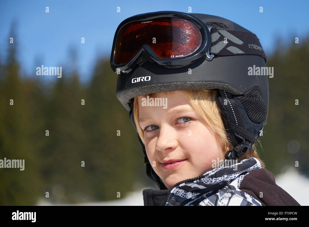 The boy on skis in mountains Stock Photo - Alamy