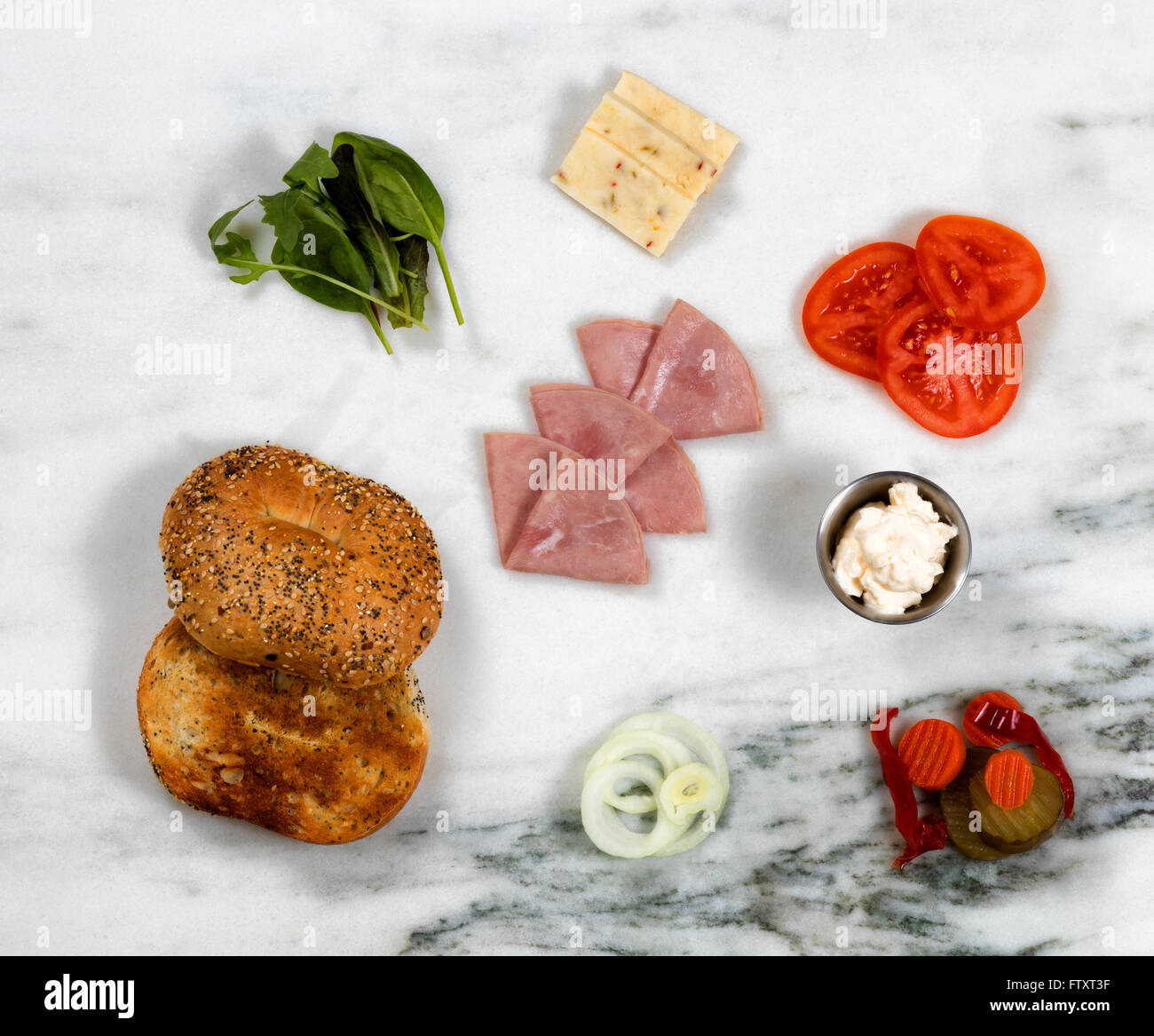 Overhead view of sandwich ingredients on white marble stone Stock Photo