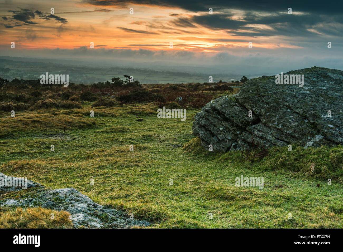 Granite outcrop rock in Dartmoor,UK at dramatic sunset Stock Photo