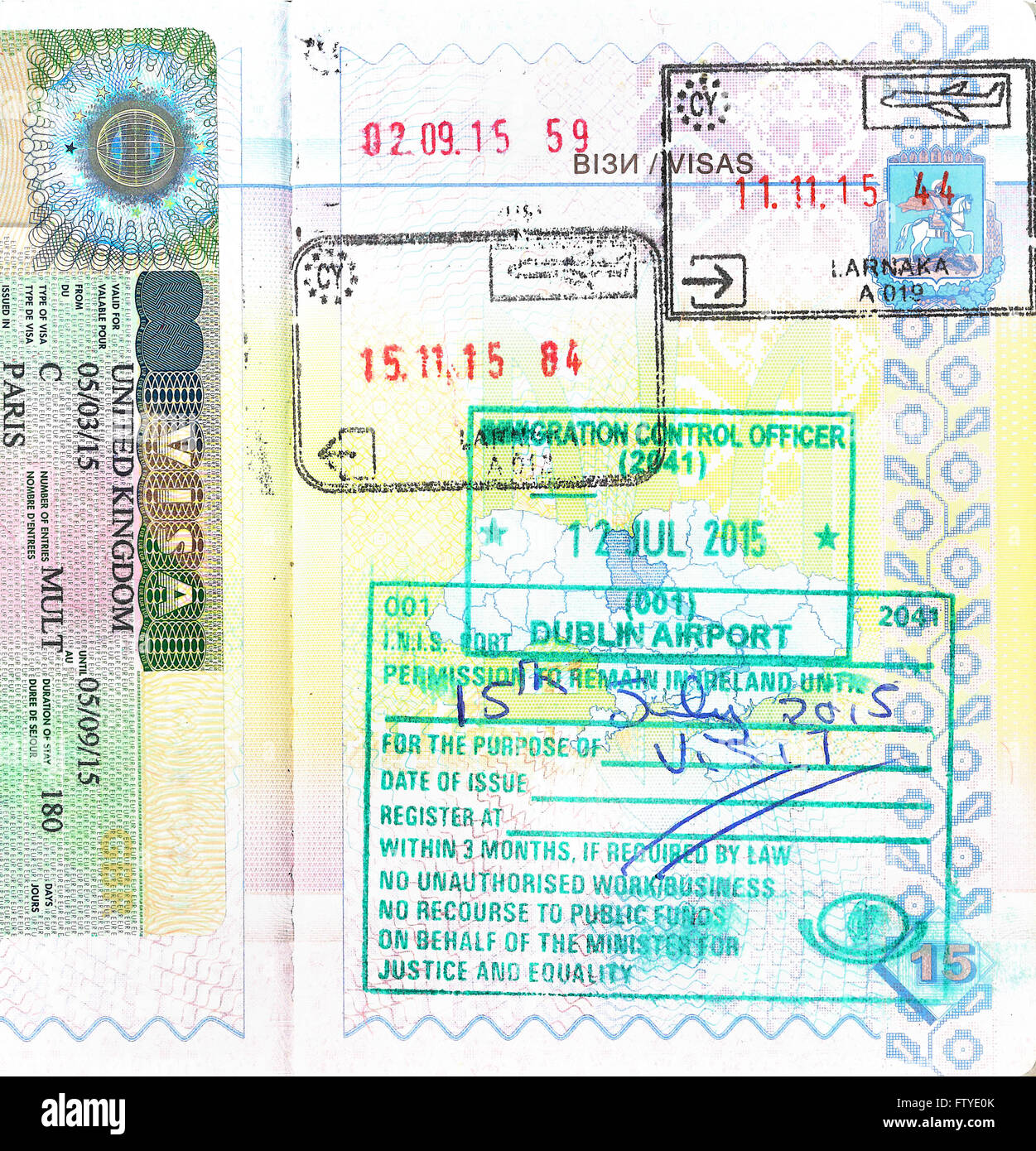 Passport with UK visa and stamps of Cyprus, Ireland Stock Photo
