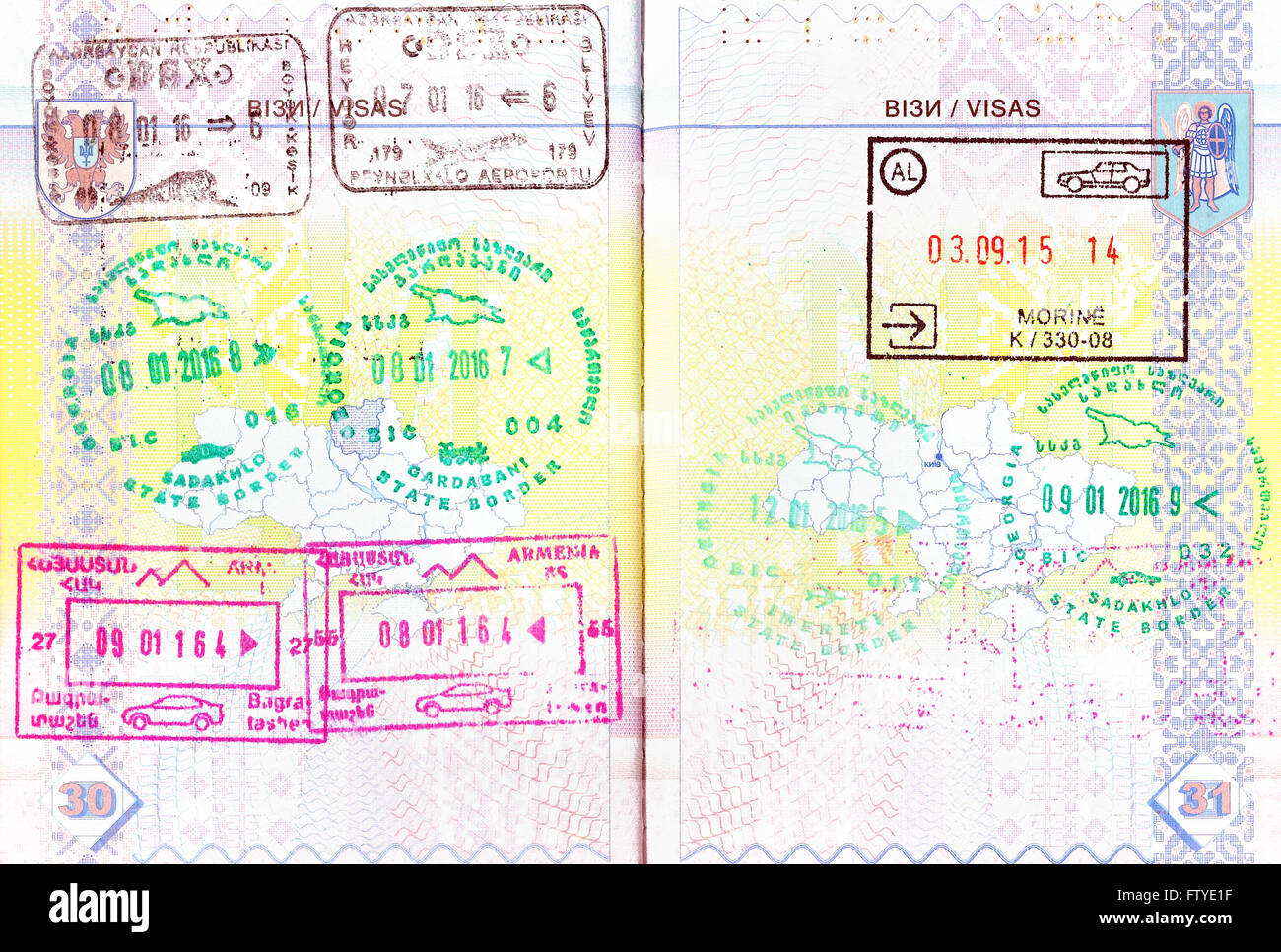 Passport with stamps of Azerbaijan, Georgia, Armenia, Albania Stock Photo