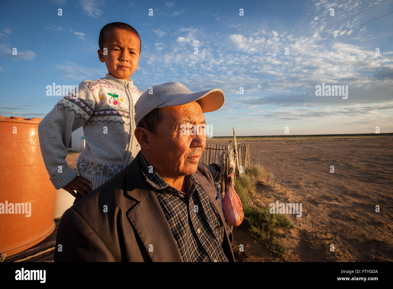 Kazakhstan, Kazakistan,boy and father in the steppe, portrait Stock ...