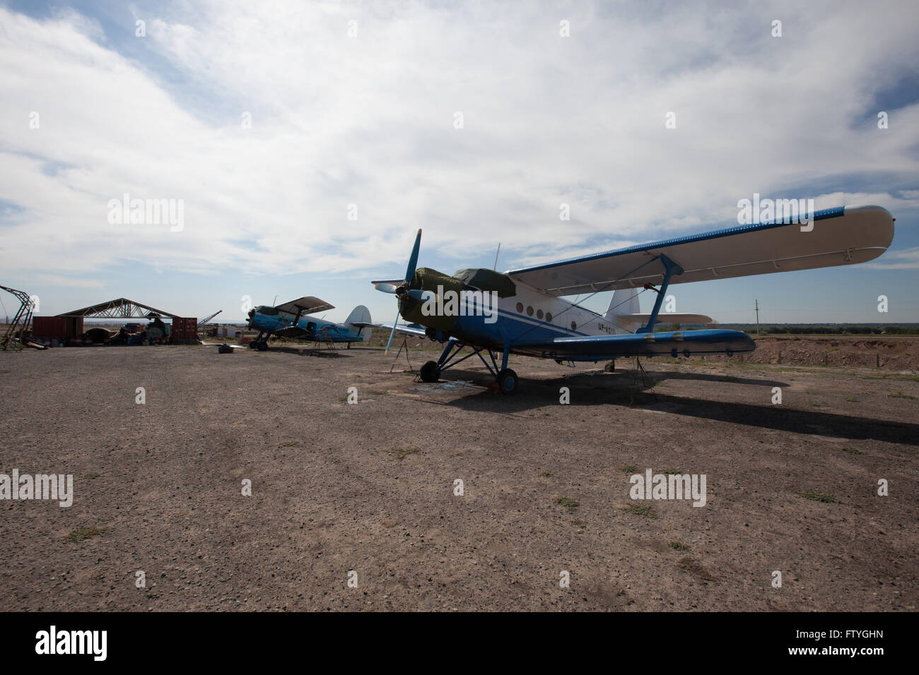 Kazakhstan, Kazakistan, Asia, landed agriculture airplanes near to the hangar. Stock Photo
