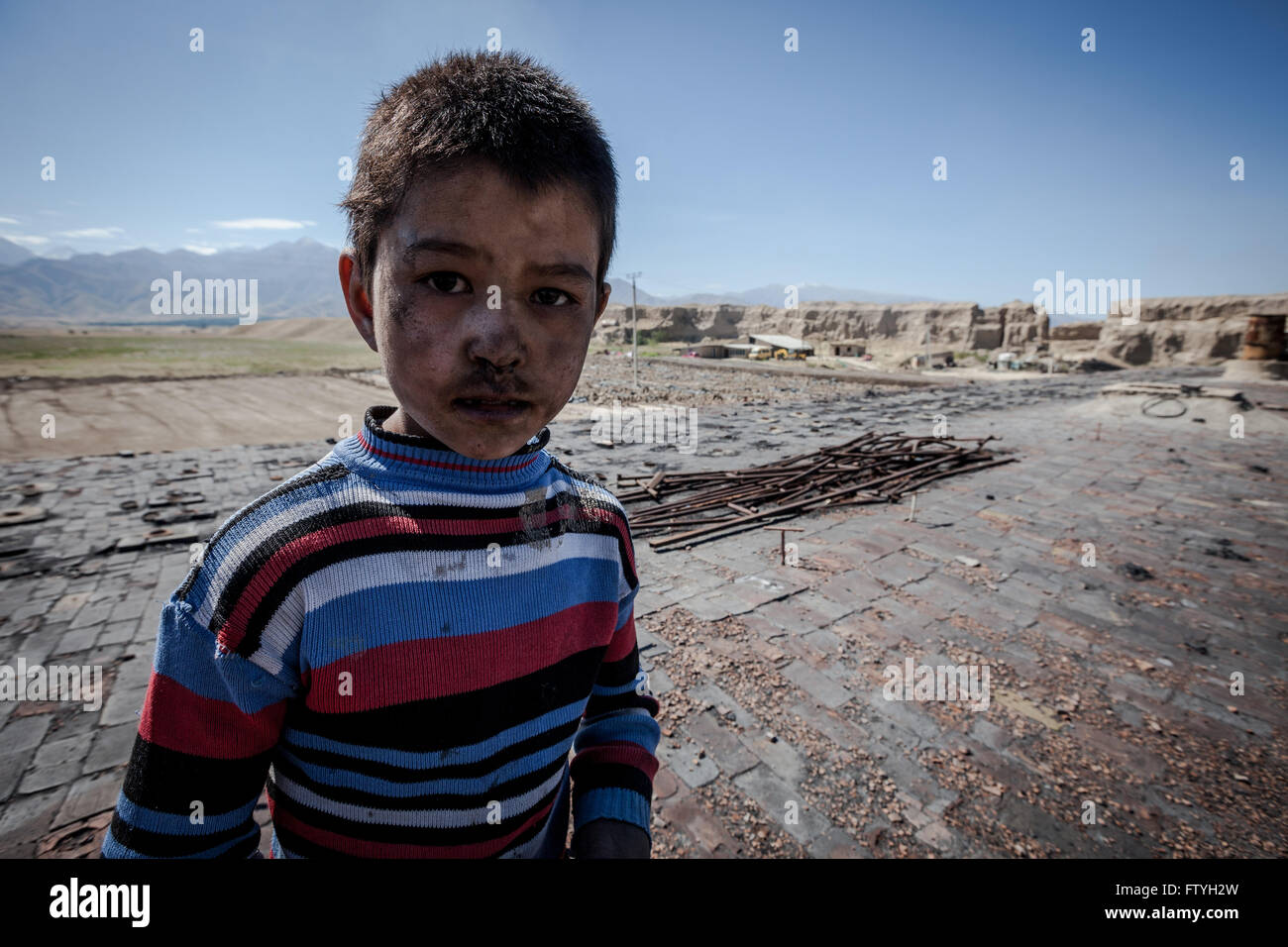 Kazakhstan, Kazakistan, a poor boy in the steppe. Stock Photo