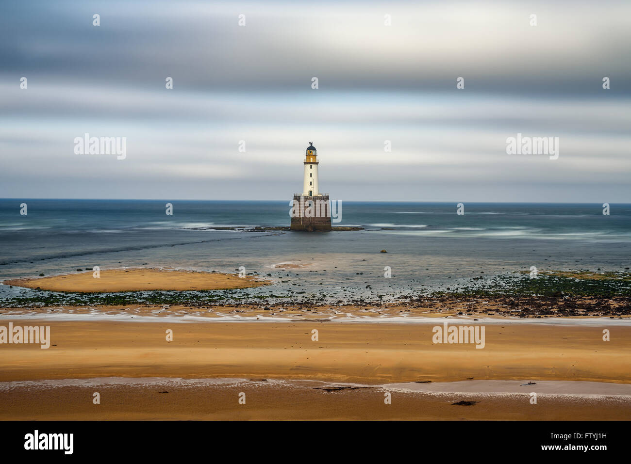 Rattray Head Lighthouse on the north east coast of Scotland, United Kingdom. Long exposure. Stock Photo