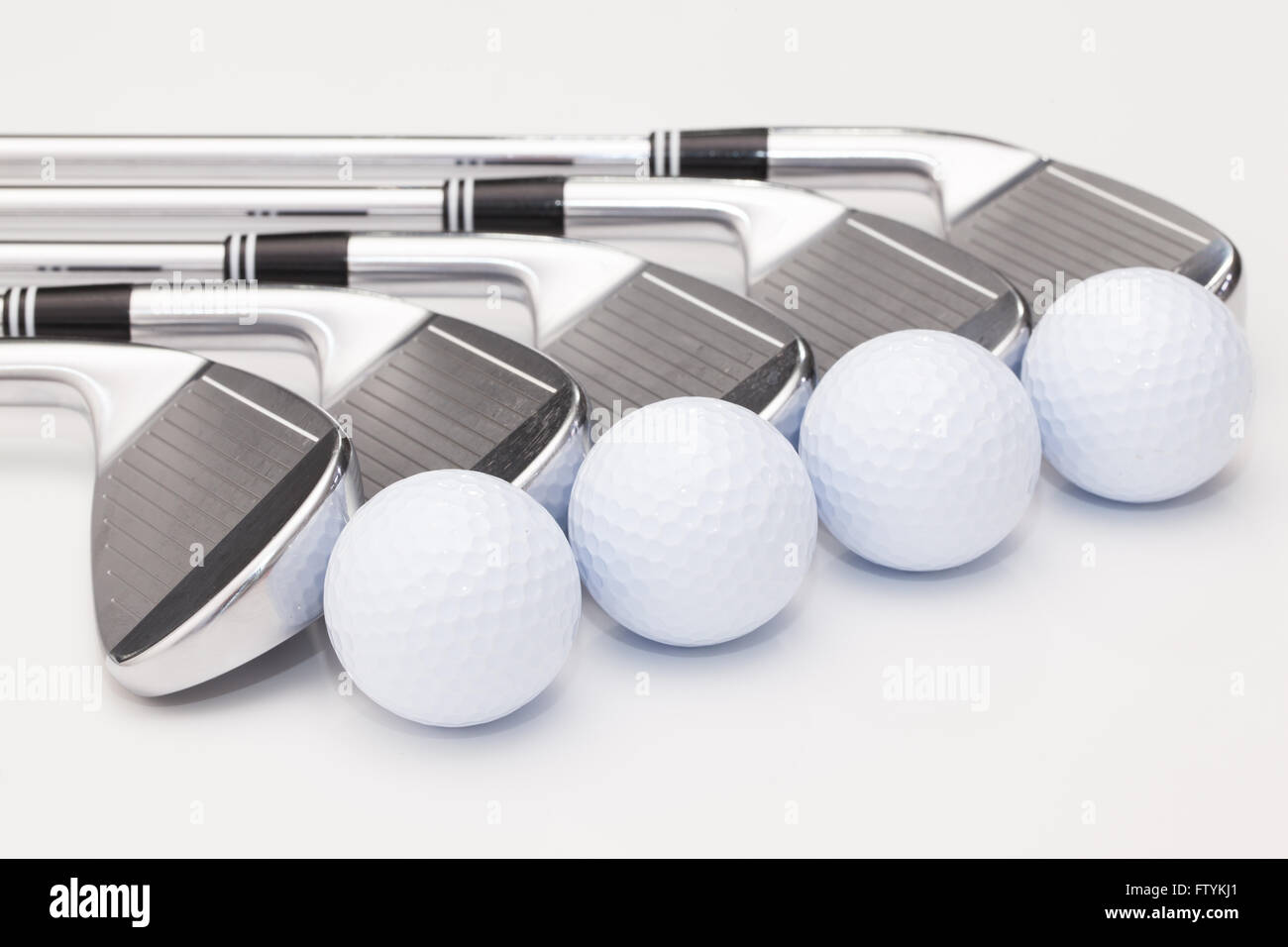 Titanium golf clubs on the white background Stock Photo Alamy