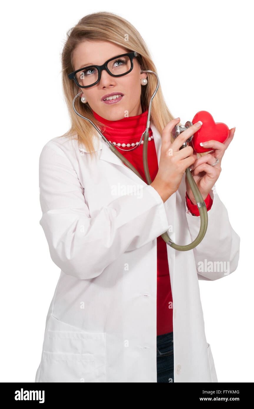 Beautiful young woman cardiologist doctor holding a heart Stock Photo