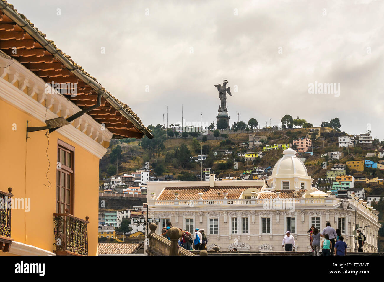 QUITO, ECUADOR, OCTOBER - 2015 -Low angle view of colonial classic style buildings and the famous panecillo hill at background a Stock Photo
