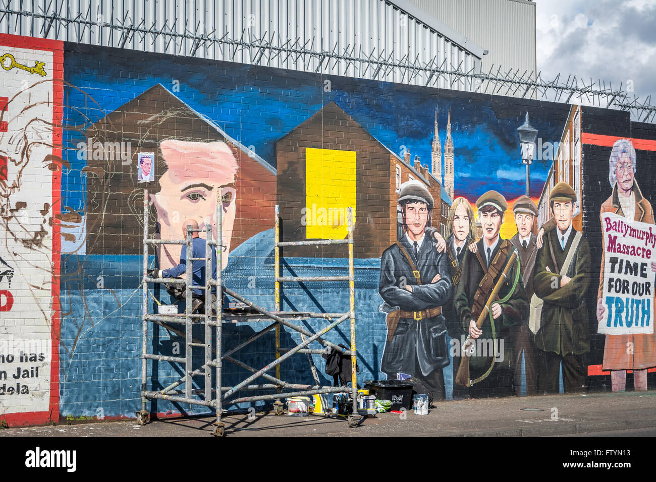 New time line mural of Easter Rising events being painted at International Wall on Falls Road, Belfast. Stock Photo