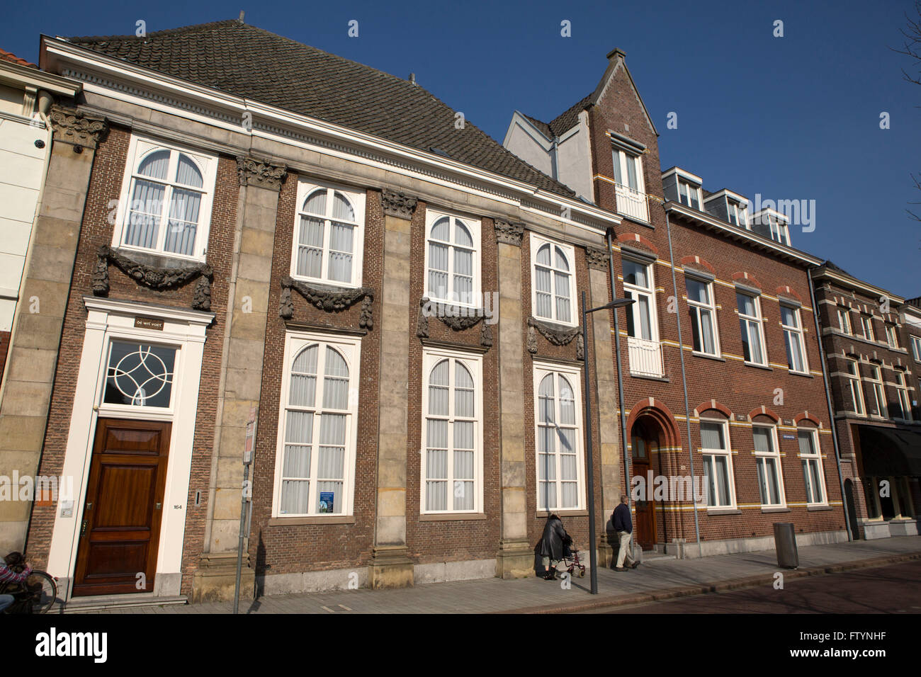 Townhouses in 's-Hertogenbosch in the Netherlands. The brick buildings stand in the city, also known as Den Bosch. Stock Photo