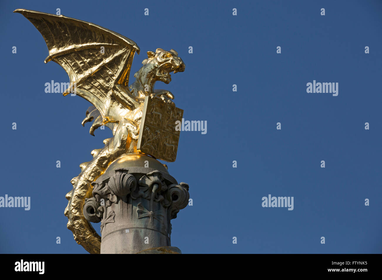 Golden Dragon statue in  's-Hertogenbosch, the Netherlands. The dragon (Draak Den Bosch) is the symbol of the city and sits on t Stock Photo