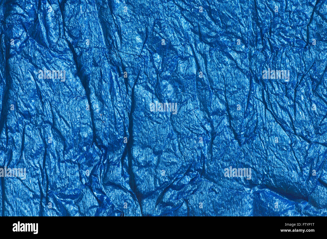 blue color crumpled metallic foil background texture Stock Photo