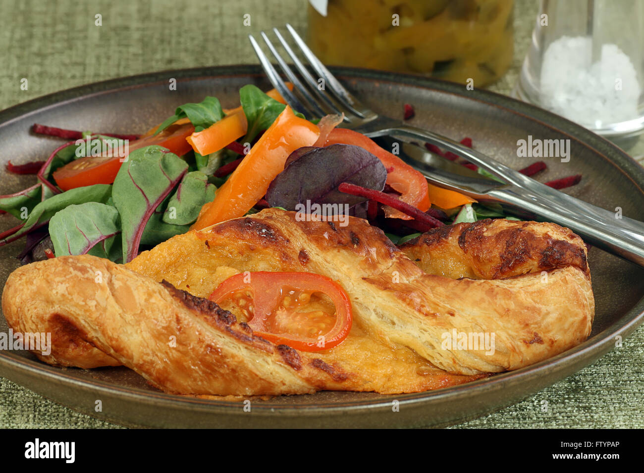 baked cheese pastry with mixed salad leaves Stock Photo