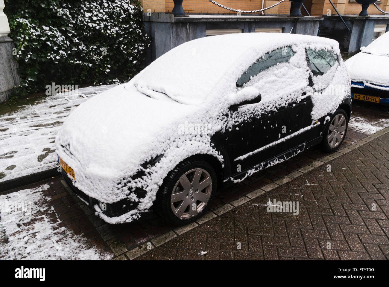 Citroën C2 small car covered in snow. Stock Photo