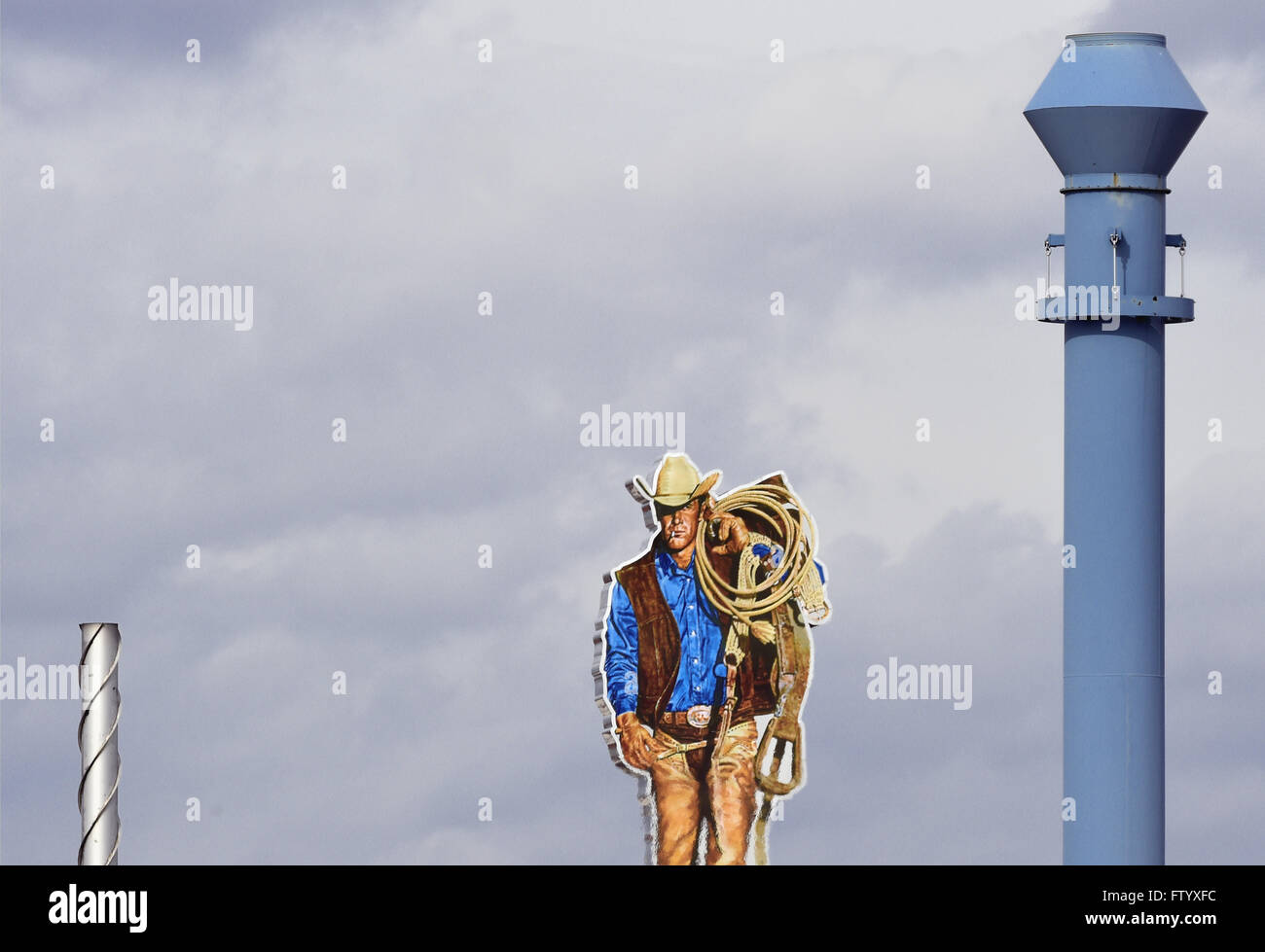 Berlin, Germany. 30th Mar, 2016. A Marlboro Man figure pictured on the rooftop of the cigarette manufacturer 'Philip Morris' in Berlin, Germany, 30 March 2016. Photo: SOEREN STACHE/dpa/Alamy Live News Stock Photo