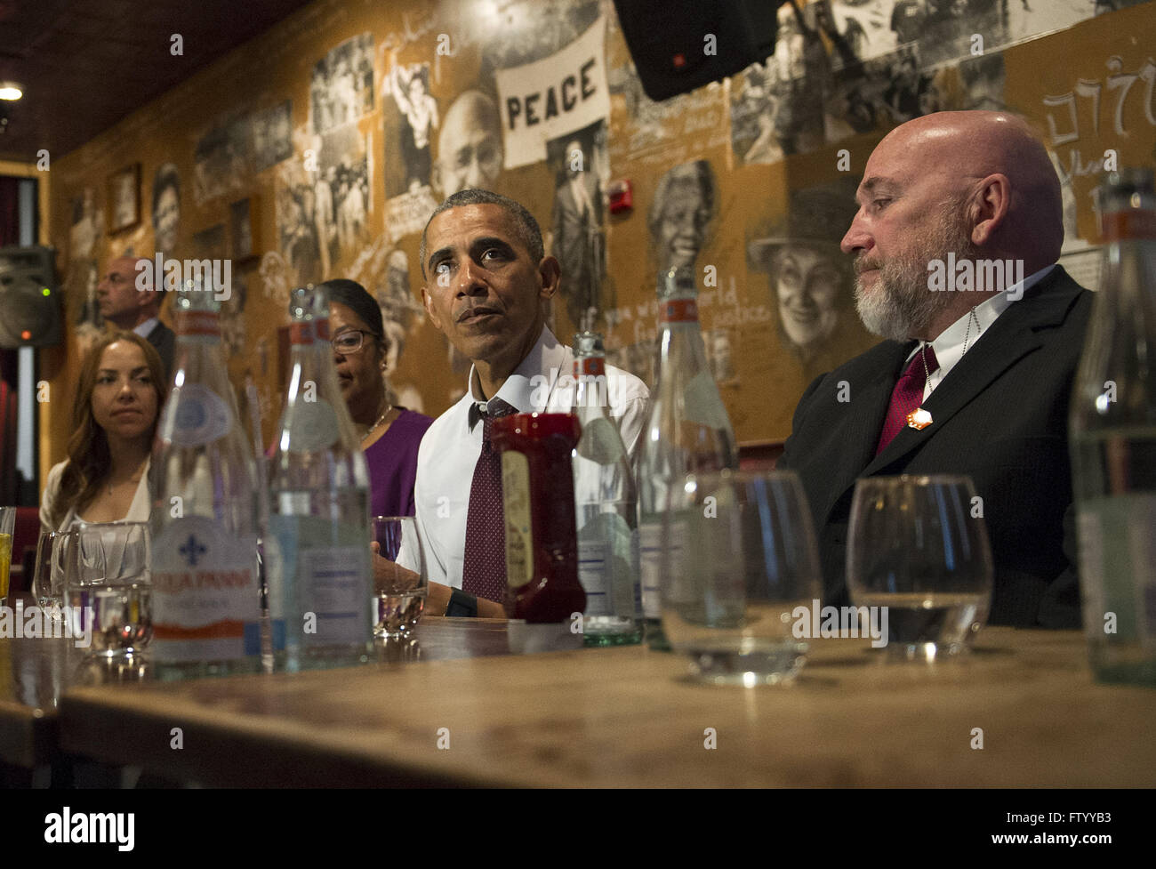 Washington, District of Columbia, USA. 30th Mar, 2016. United States President Barack Obama speaks to the media after having lunch with formerly incarcerated individuals who have received commutations, at Bus Boys and Poets restaurant in Washington, DC on March 30, 2016. Obama commuted 61 additional sentences today.Credit: Kevin Dietsch/Pool via CNP © Kevin Dietsch/CNP/ZUMA Wire/Alamy Live News Stock Photo