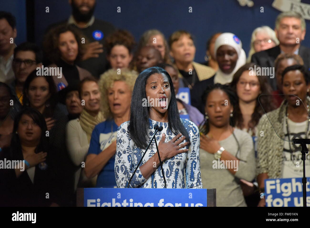 New York City, United States. 30th Mar, 2016. Renee Elise Goldsberry sings the national anthem. Democratic primary front runner Hillary Clinton appeared before hundreds of supporters in Harlem's Apollo Theater to hear her address issues such as income inequality & gun control © Andy Katz/Pacific Press/Alamy Live News Stock Photo