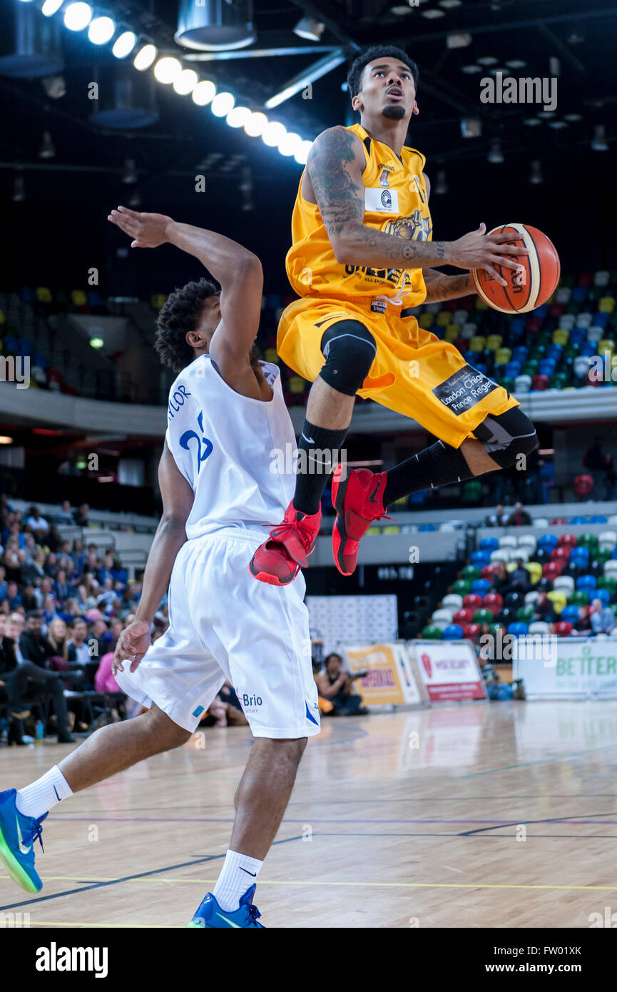 London, UK. 30th March 2016. Lions guard (11), Nick Lewis, airborne, as London Lions play Cheshire Phoenix in the British Basketball League (BBL) game at the Copper Box , Queen Elizabeth Olympic Park. Final score - London Lions 79, Cheshire Phoenix 69.  Credit:  Stephen Chung / Alamy Live News Stock Photo