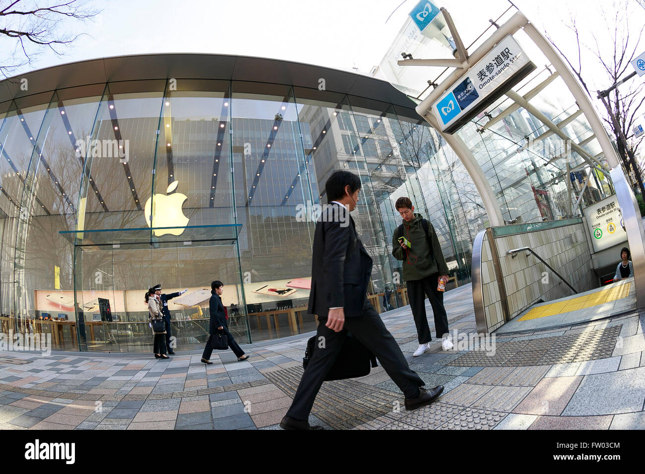 Tokyo Metro Commuters Walk Past The Apple Store Before Opens
