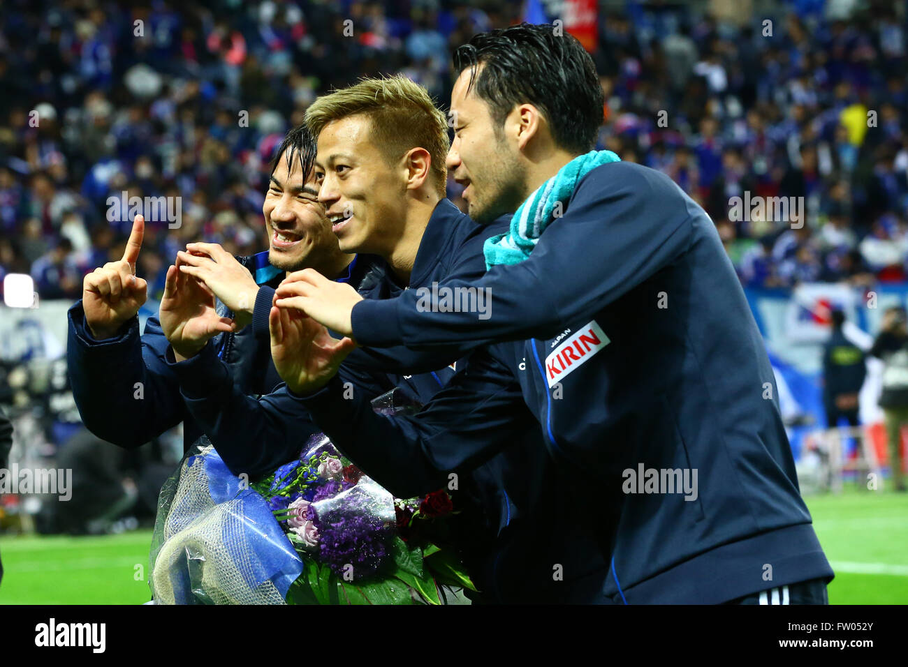 Saitama, Japan. 29th Mar, 2016. (L-R) Shinji Okazaki, Keisuke Honda, Maya Yoshida (JPN) Football/Soccer : Shinji Okazaki of Japan celebrates his 100th international cap with his teammates Keisuke Honda and Maya Yoshida after the FIFA World Cup Russia 2018 Asian Qualifier Second Round Group E match between Japan 5-0 Syria at Saitama Stadium 2002 in Saitama, Japan . © Kenzaburo Matsuoka/AFLO/Alamy Live News Stock Photo