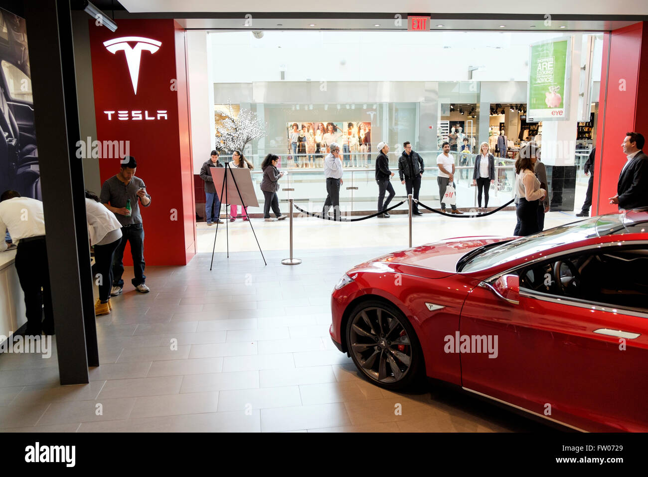 California, USA. 31st Mar, 2016. Automotive history is being made around the world today as customers line up at Tesla Motors stores and galleries to reserve a car they haven't seen yet. The Tesla Model 3 is unveiled at 8.30pm PDT on March 31st in California, USA. Credit:  Thomas Bland/Alamy Live News Stock Photo