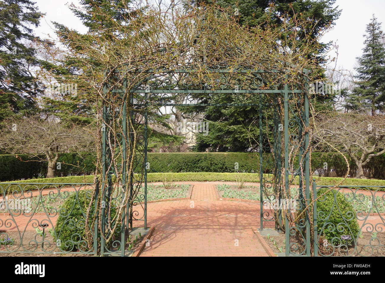 empty archway on garden path with no one Stock Photo