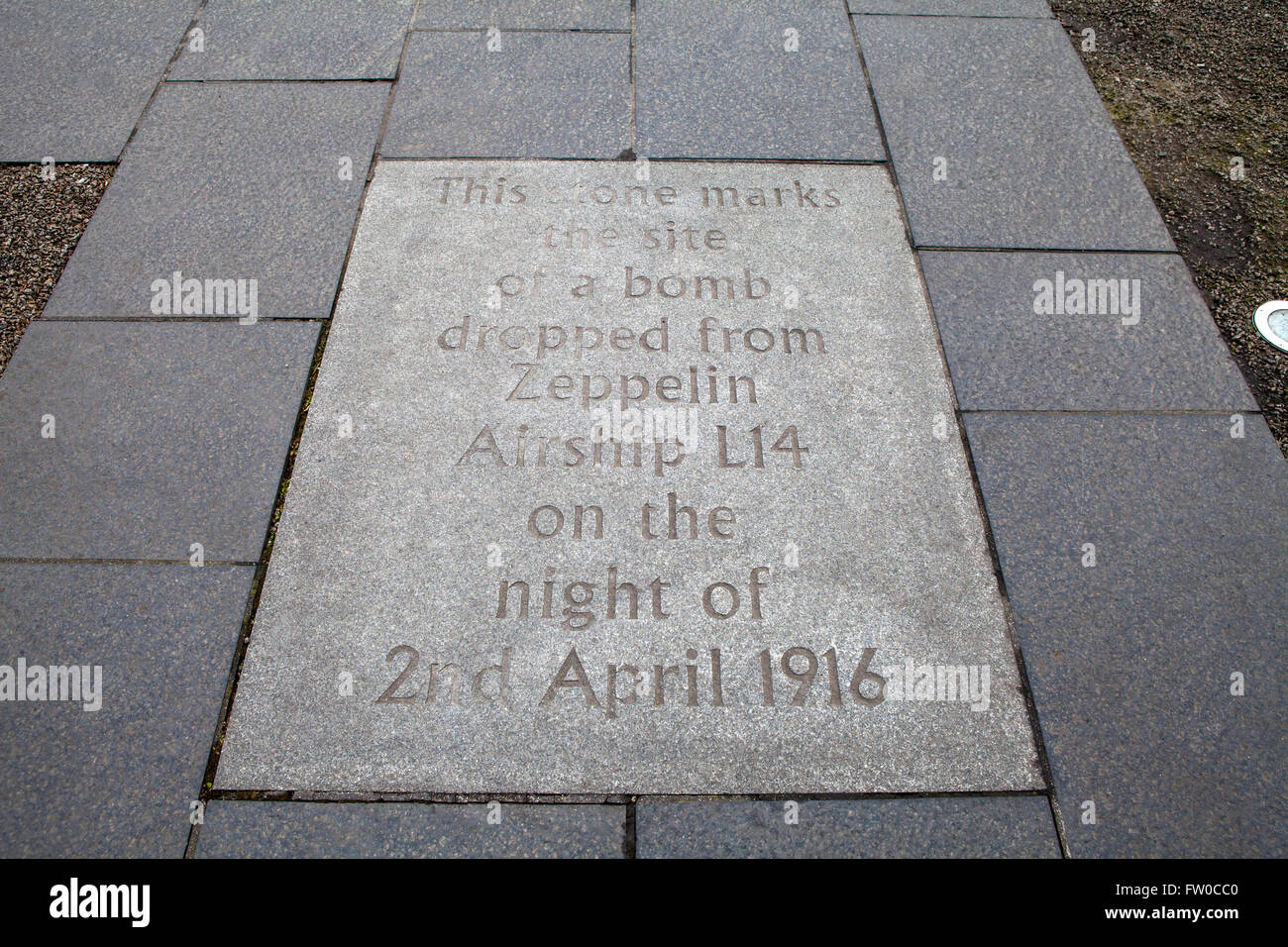 A plaque on the ground in Grassmarket noting the site where a bomb was dropped from a Zeppelin Airship during the first world wa Stock Photo