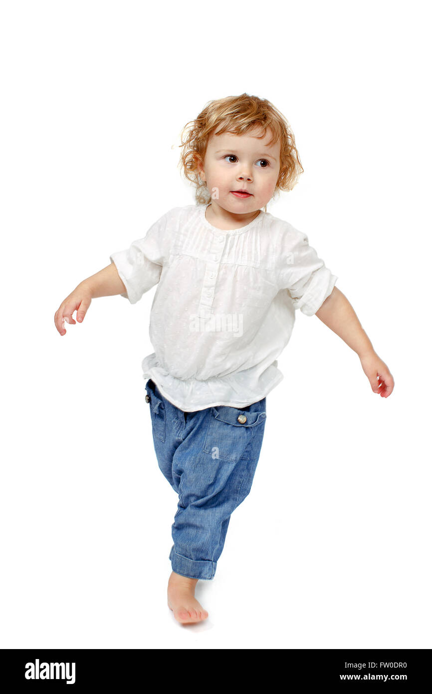 Baby taking first steps Stock Photo