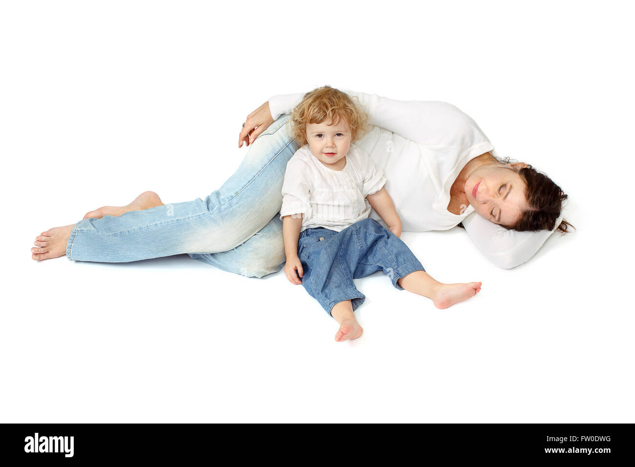 Mom sleep, the child is awake Stock Photo