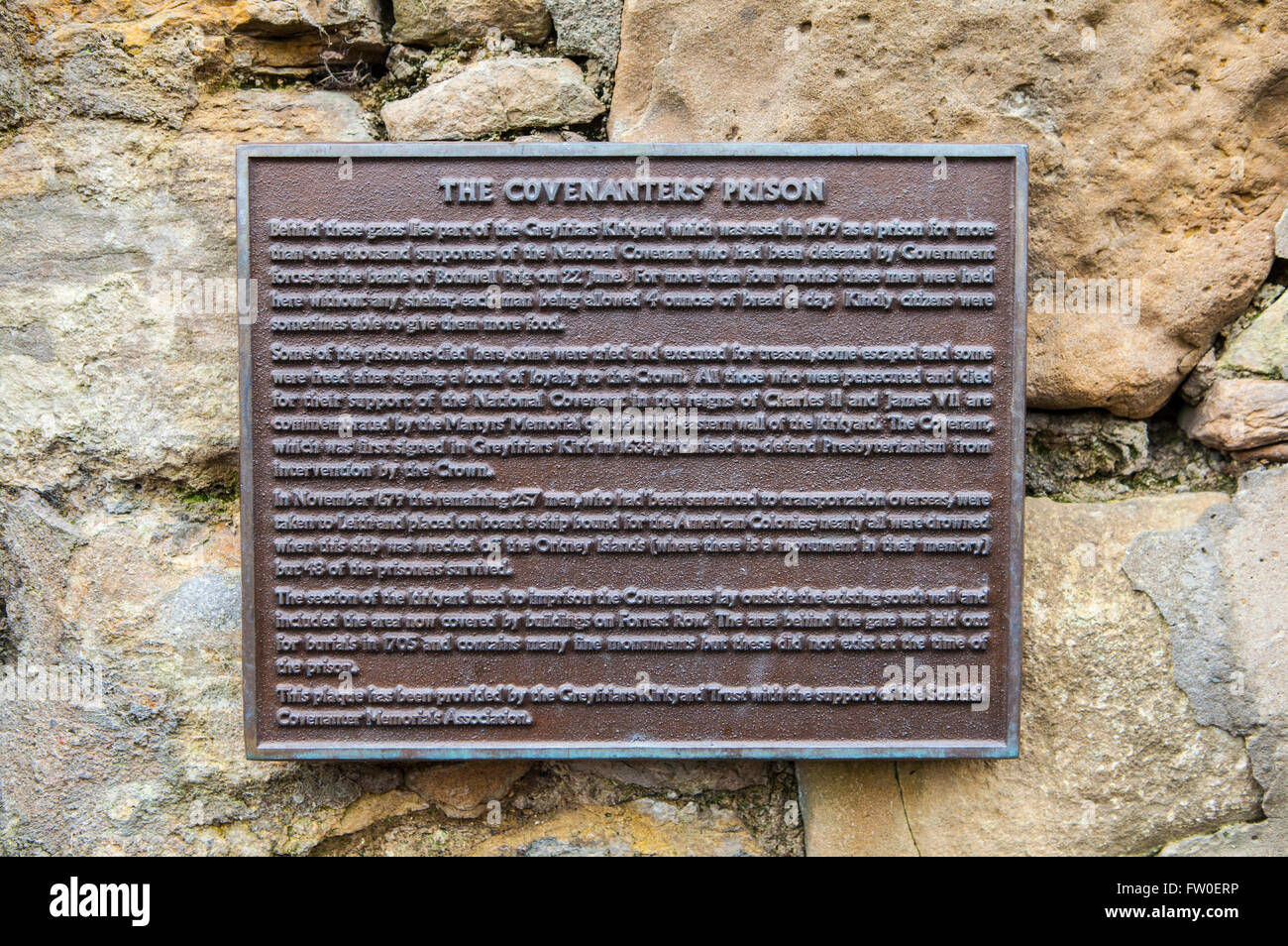 A plaque detailing the location of the Covenanters Prison in Greyfriars Churchyard in Edinburgh. Stock Photo