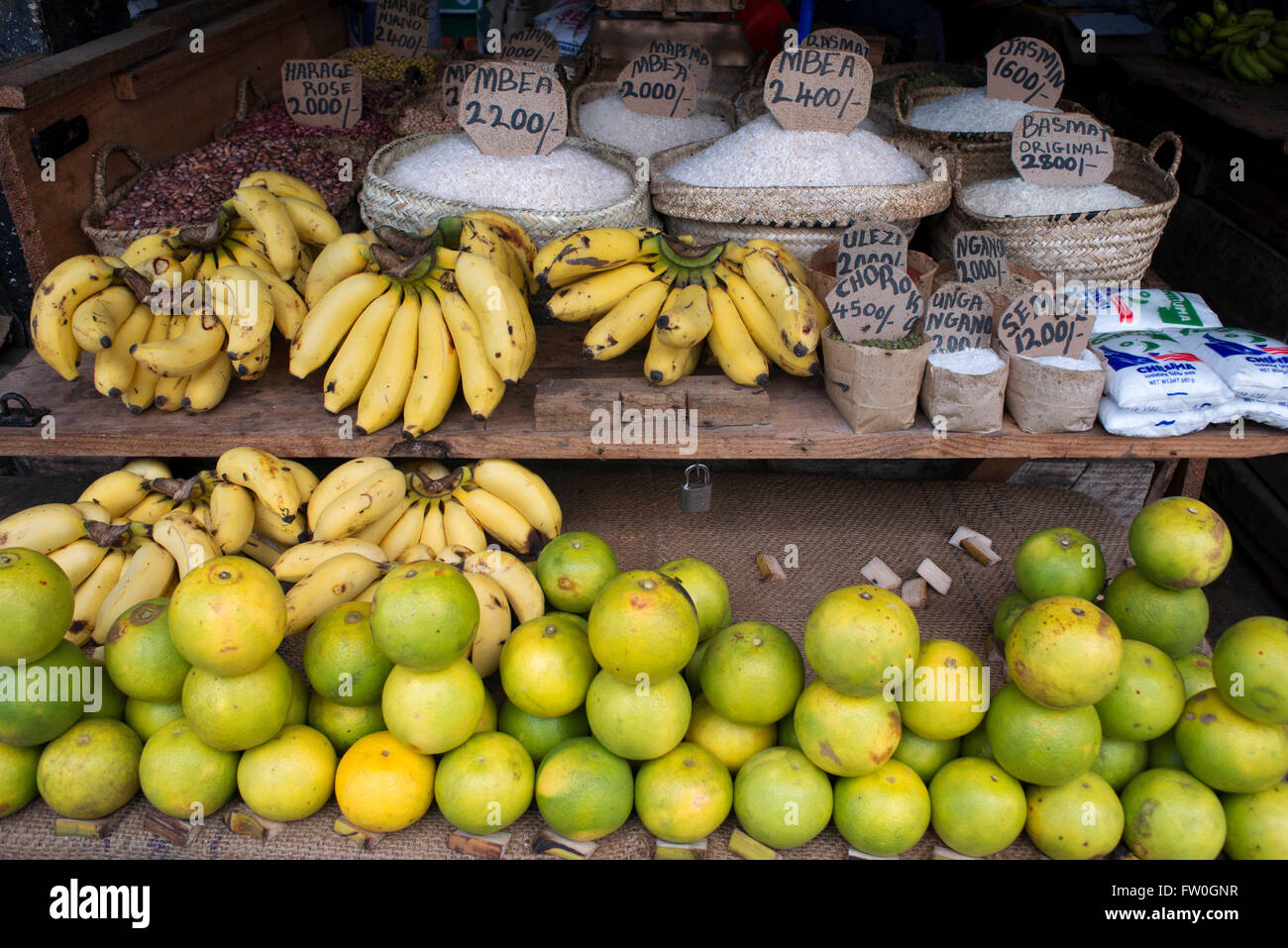 Sale of limes, bananas and different types of rice in the Stone Town market, Zanzibar, Tanzania. Stock Photo