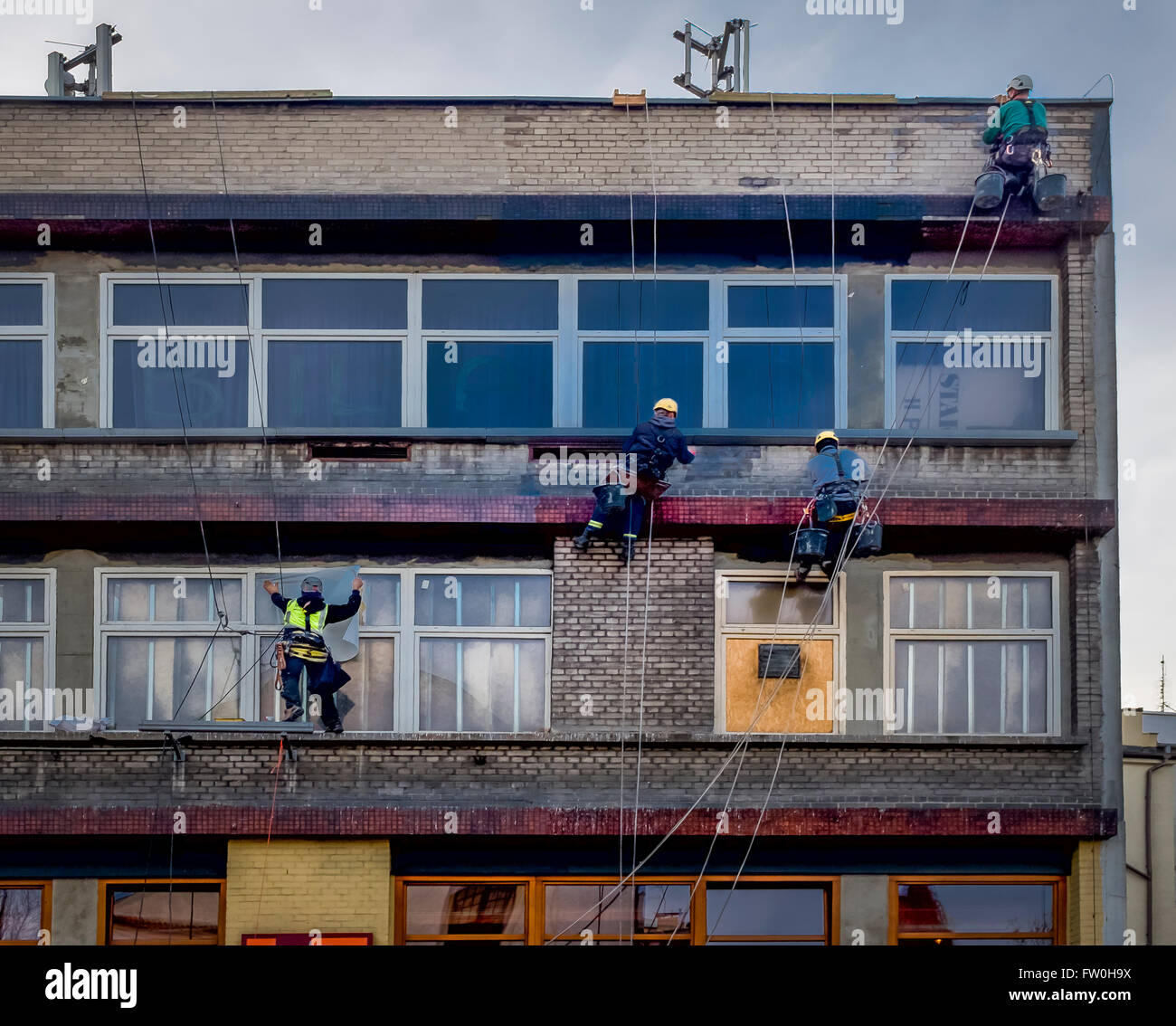 Polish builders working on scaffolding in Krakow, Lesser Poland Stock