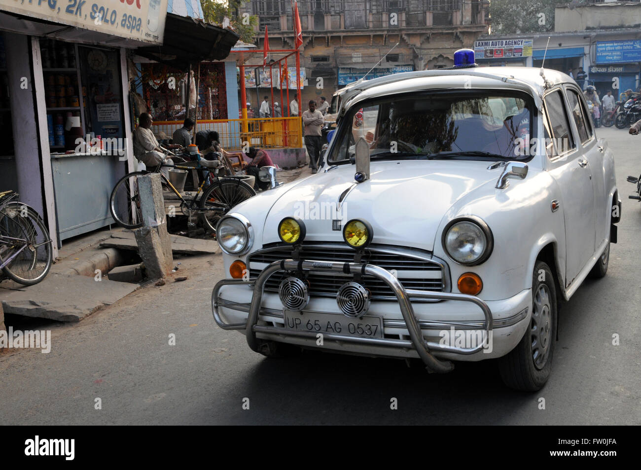 A Hindustan Ambassador, cherished by its present owner, parked in the street at Varanasi, Northern India. Stock Photo