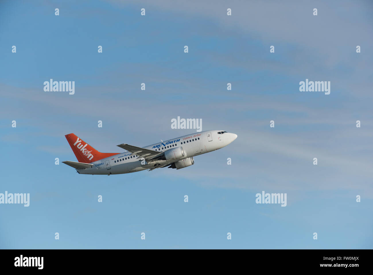 Yukon, Boeing 737-500 (twin-jet) in air. Stock Photo