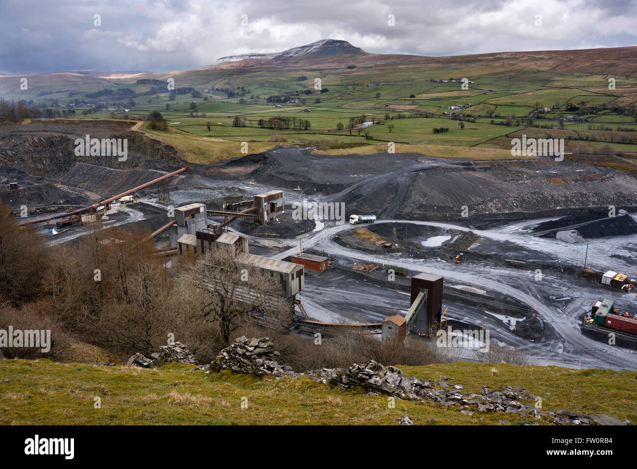 Tarmac's Arcow Quarry, Helwith Bridge, with Pen-y-ghent in the distance, Yorkshire Dales National Park, UK Stock Photo