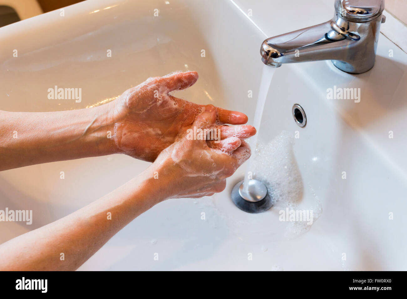 Woman Washing Hands With Soap In The Sink Stock Photo Alamy woman-washing-hands-with-soap-in-the-sink-stock-photo-alamy