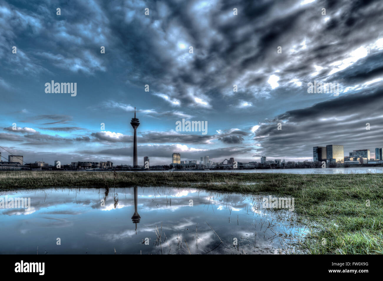 Rhine meadows with reflections at Duesseldorf during floods of river rhine Stock Photo