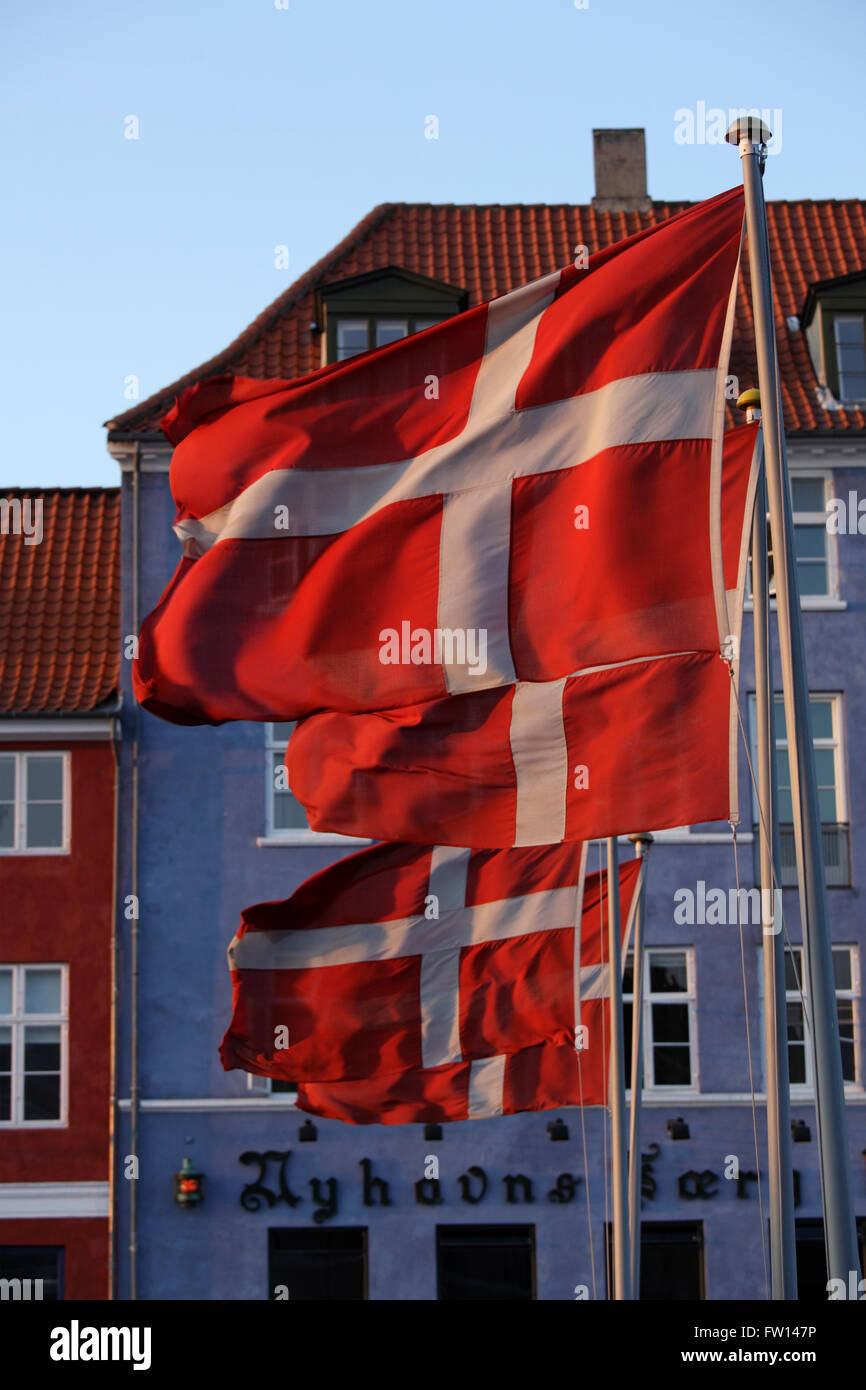 Flags at Nyhavn canal, Copenhagen, Denmark Stock Photo