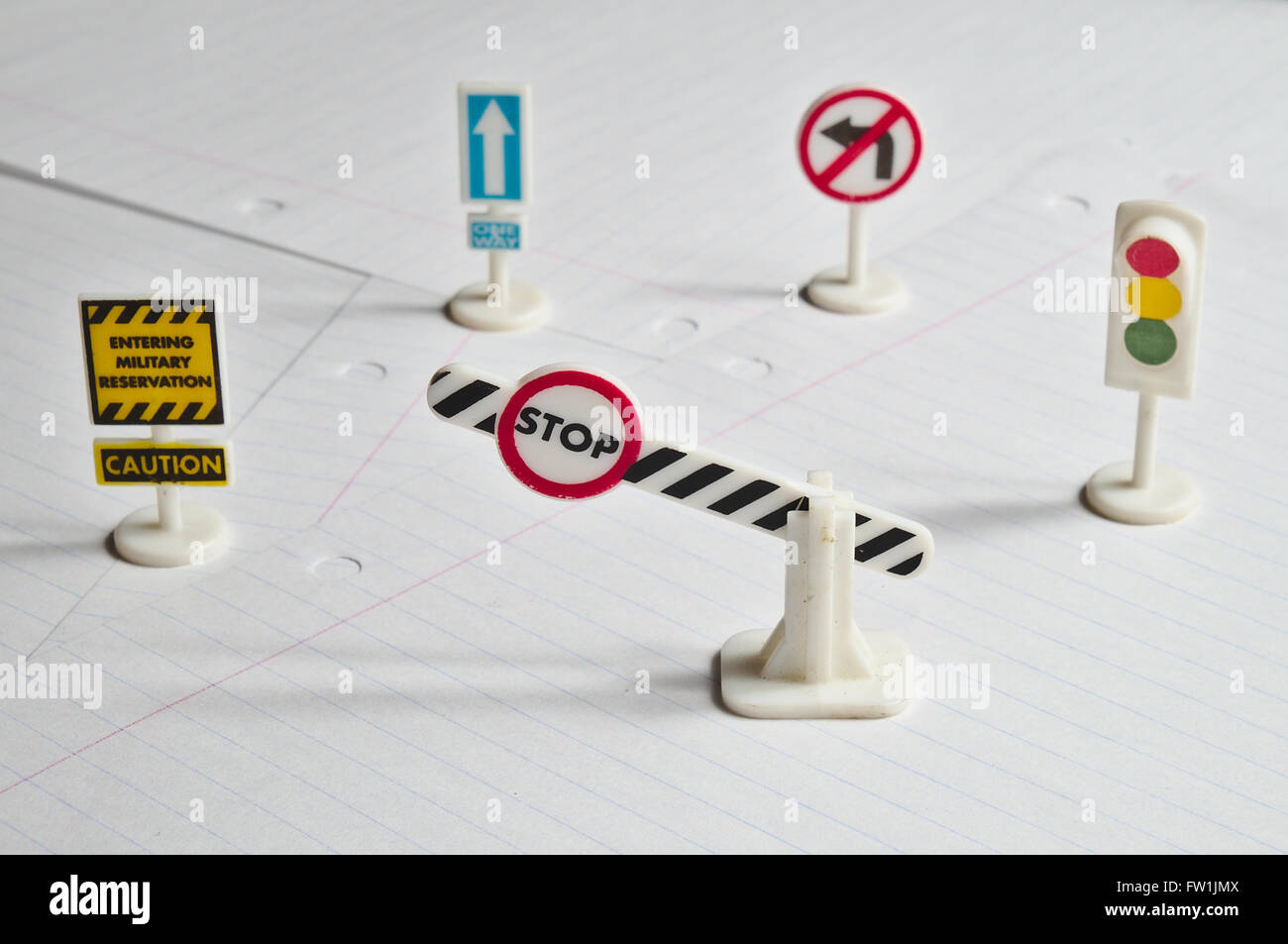 Notepad, book of traffic rules, toy cars, traffic lights and stop sign