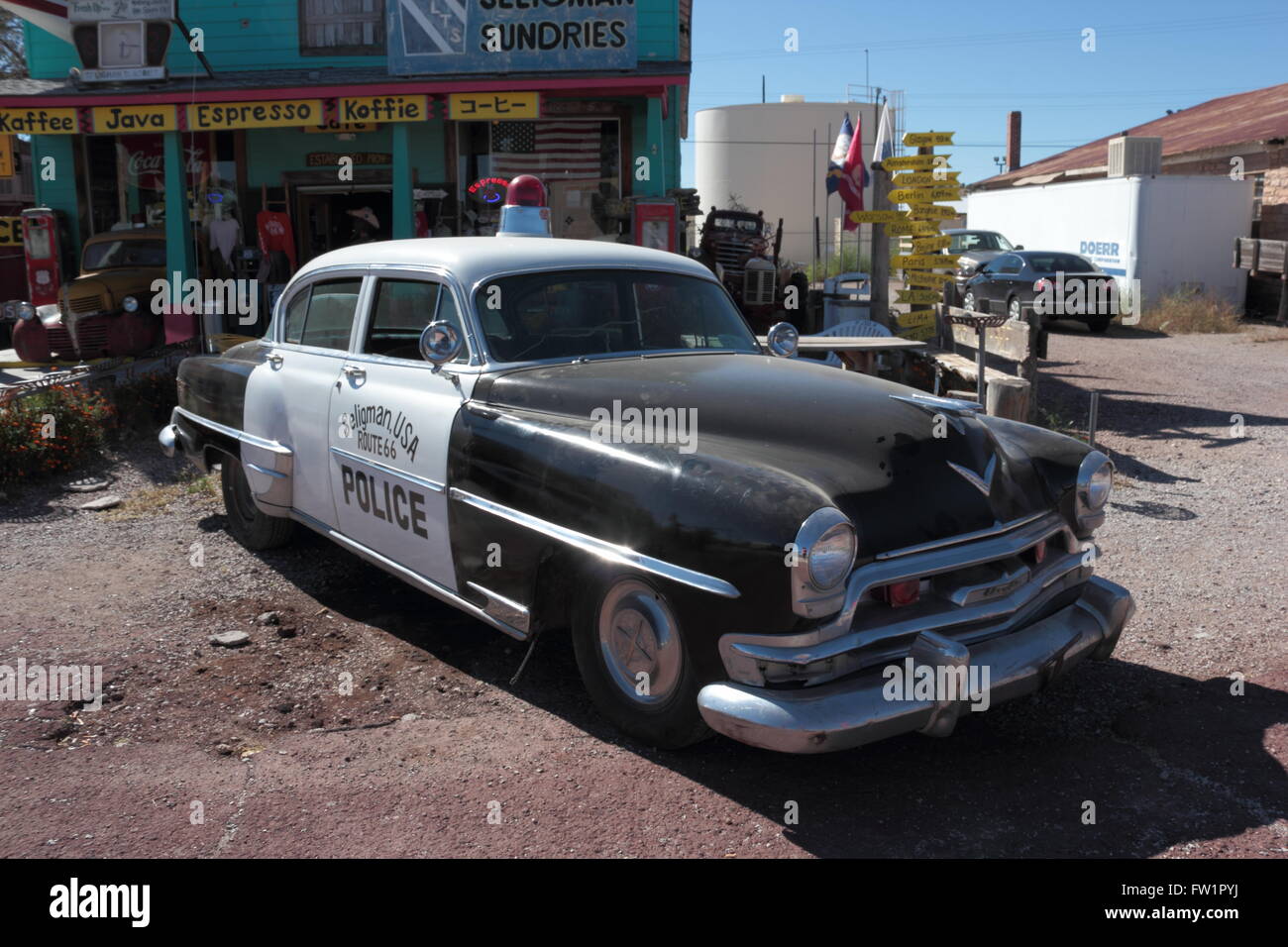Police car outside the Seligman Sundries Building, Route 66, now bypassed by Interstate 40, Seligman, Arizona, USA. Stock Photo