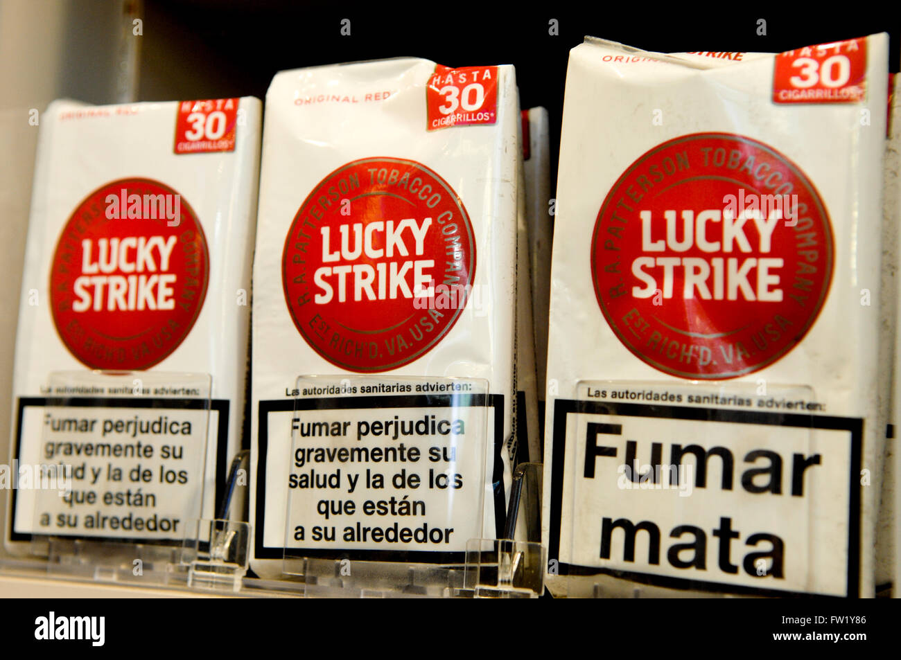 Lucky Strike Cigarettes produced by British American Tobacco on sale in a tobacconist. Stock Photo