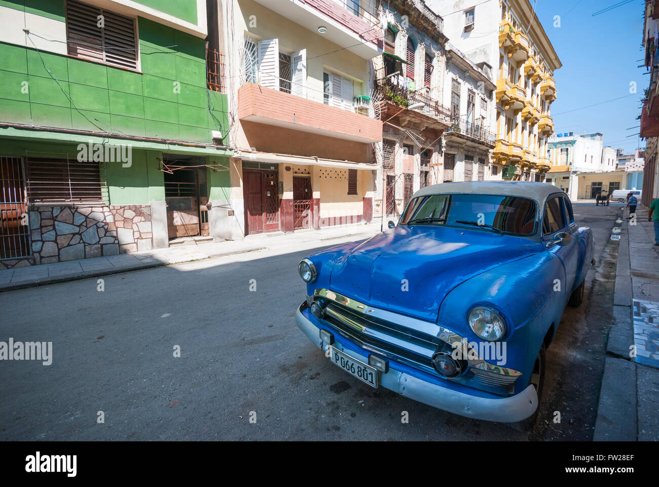 A classic antique American Chevrolet car undergoing body work and parked on a side street in Central Havana Cuba Stock Photo