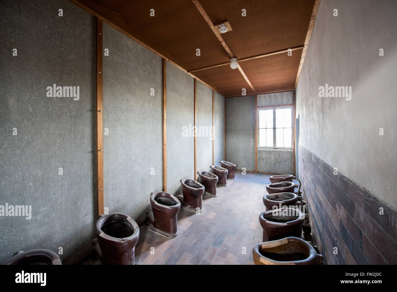 Prisoner toilets in barracks in Dachau concentration camp Stock Photo