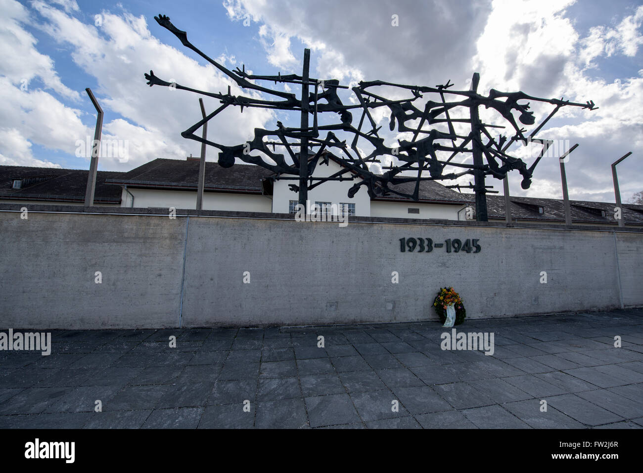 Memorial sculpture in front of the main building in Dachau concentration camp Stock Photo