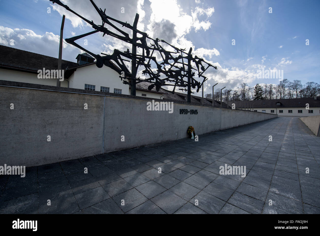 Memorial sculpture in front of the main building in Dachau concentration camp Stock Photo